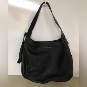 Michael Kors black genuine leather shoulder purse.